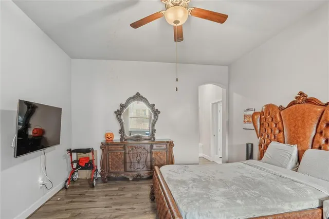 a bedroom with a bed and a couch