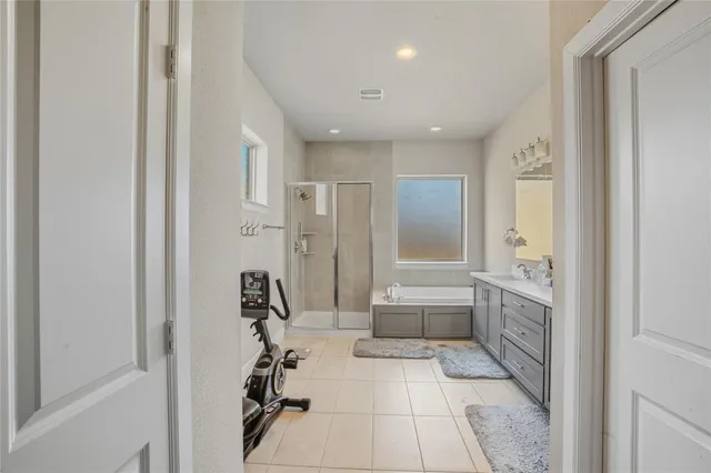 a view of walk in closet with clothes