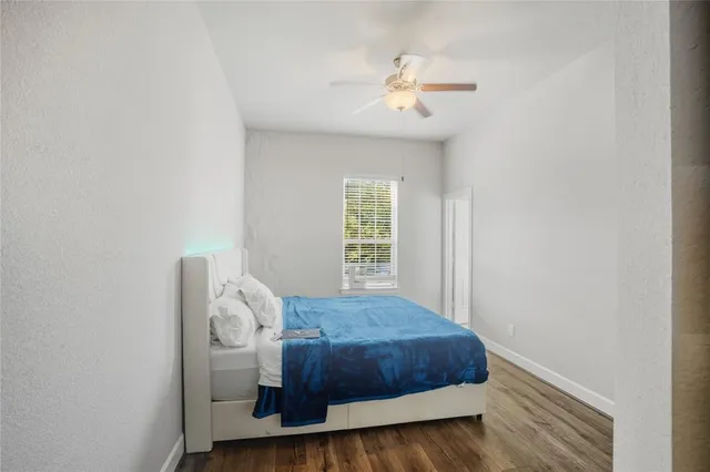 a bathroom with a sink a toilet a mirror and shower