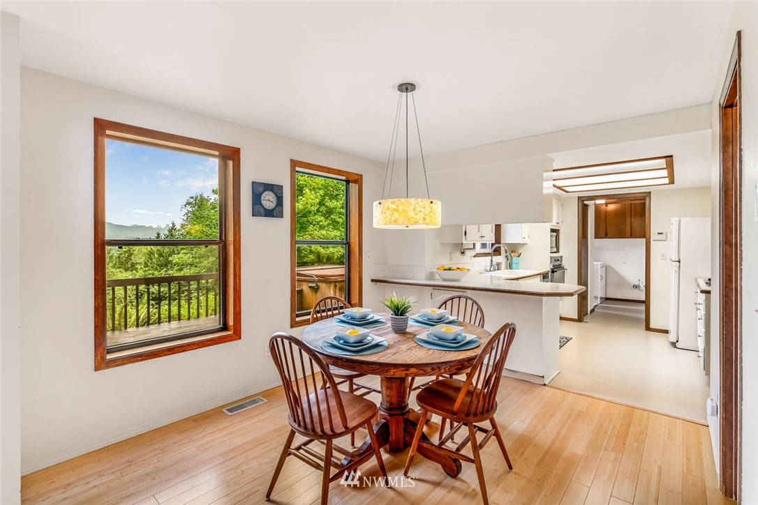 9513 Tveit Road Arlington, WA 98223 - Photo 14 of 40 a dining room with furniture and window