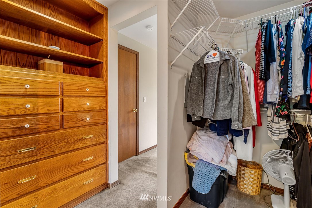 9513 Tveit Road Arlington, WA 98223 - Photo 22 of 40 a view of walk in closet with clothes and shoes