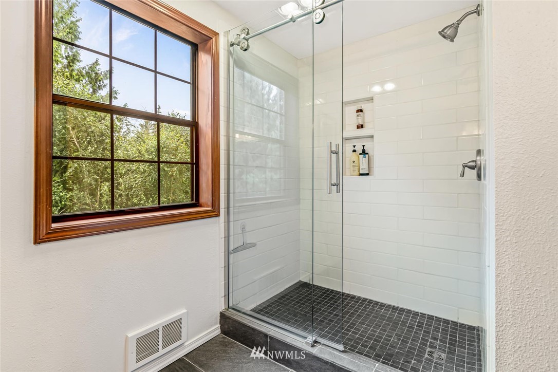9513 Tveit Road Arlington, WA 98223 - Photo 24 of 40 a bathroom with a shower