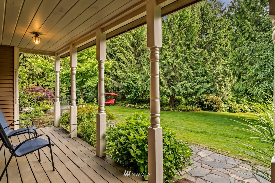 9513 Tveit Road Arlington, WA 98223 - Photo 4 of 40 a view of a room with a large trees and plants