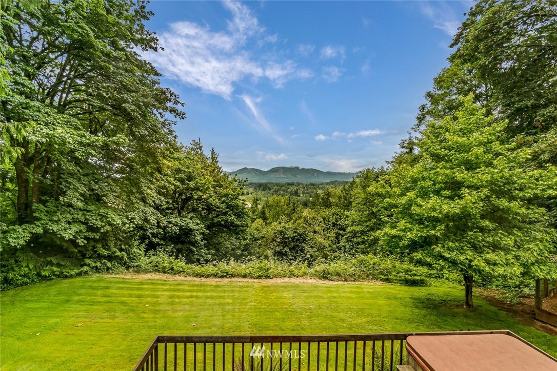 9513 Tveit Road Arlington, WA 98223 - Photo 32 of 40 a view of a lake from a yard
