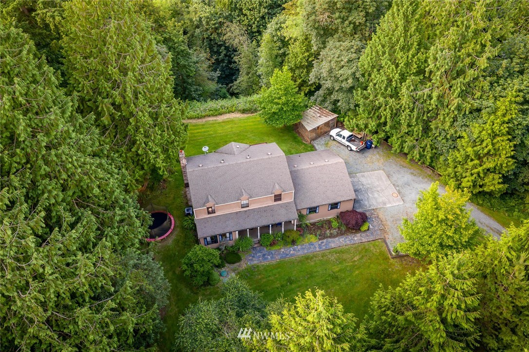 9513 Tveit Road Arlington, WA 98223 - Photo 38 of 40 an aerial view of a house with yard and outdoor seating