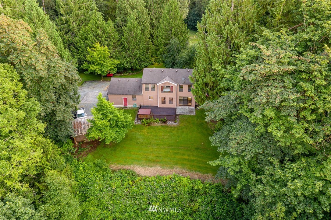 9513 Tveit Road Arlington, WA 98223 - Photo 40 of 40 an aerial view of a house with a yard