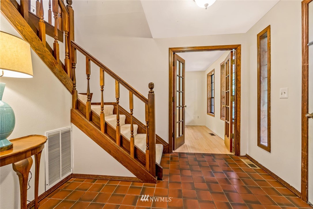9513 Tveit Road Arlington, WA 98223 - Photo 5 of 40 a view of an entryway with wooden floor and stairs