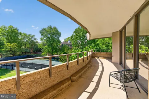 a view of balcony with furniture