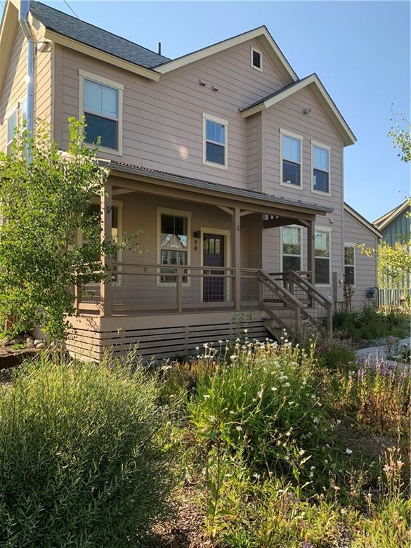 48 Meridian Alley Frisco, CO 80443 - Photo 1 of 9 a front view of a house with a garden