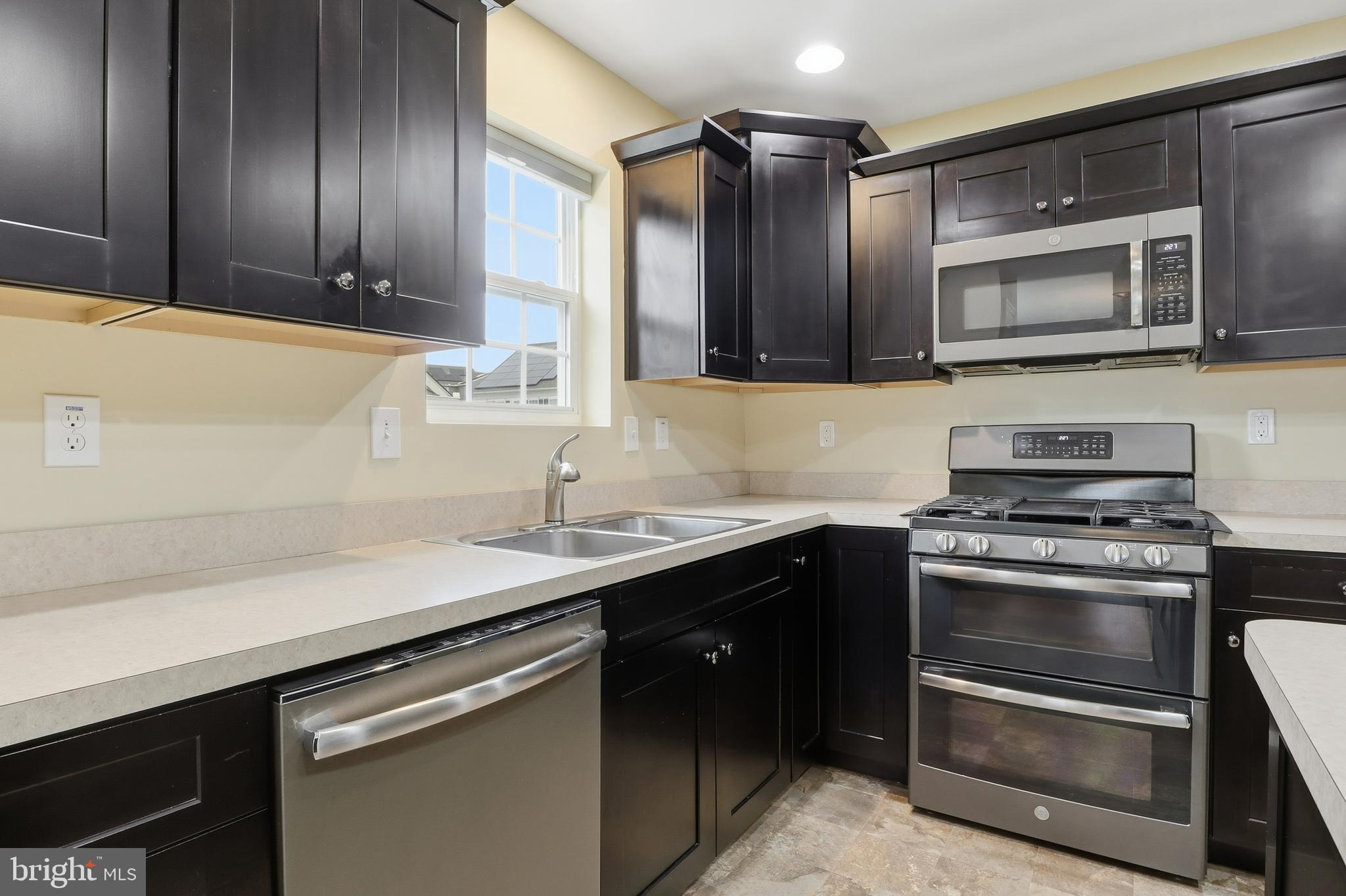 2606 Woodspring Drive York, PA 17402 - Photo 13 of 60 a kitchen with a sink and stainless steel appliances