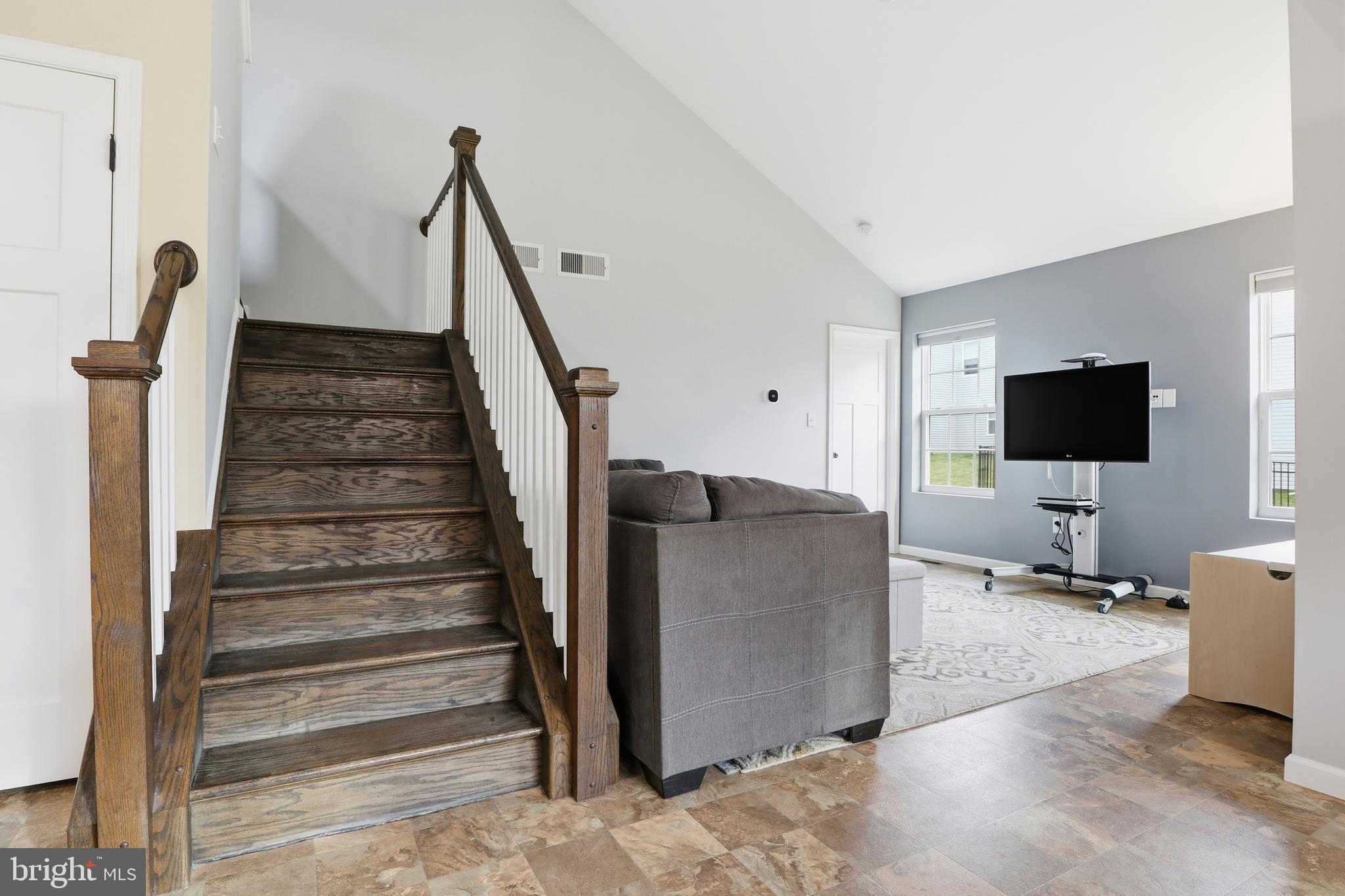 2606 Woodspring Drive York, PA 17402 - Photo 18 of 60 a living room with furniture and a flat screen tv