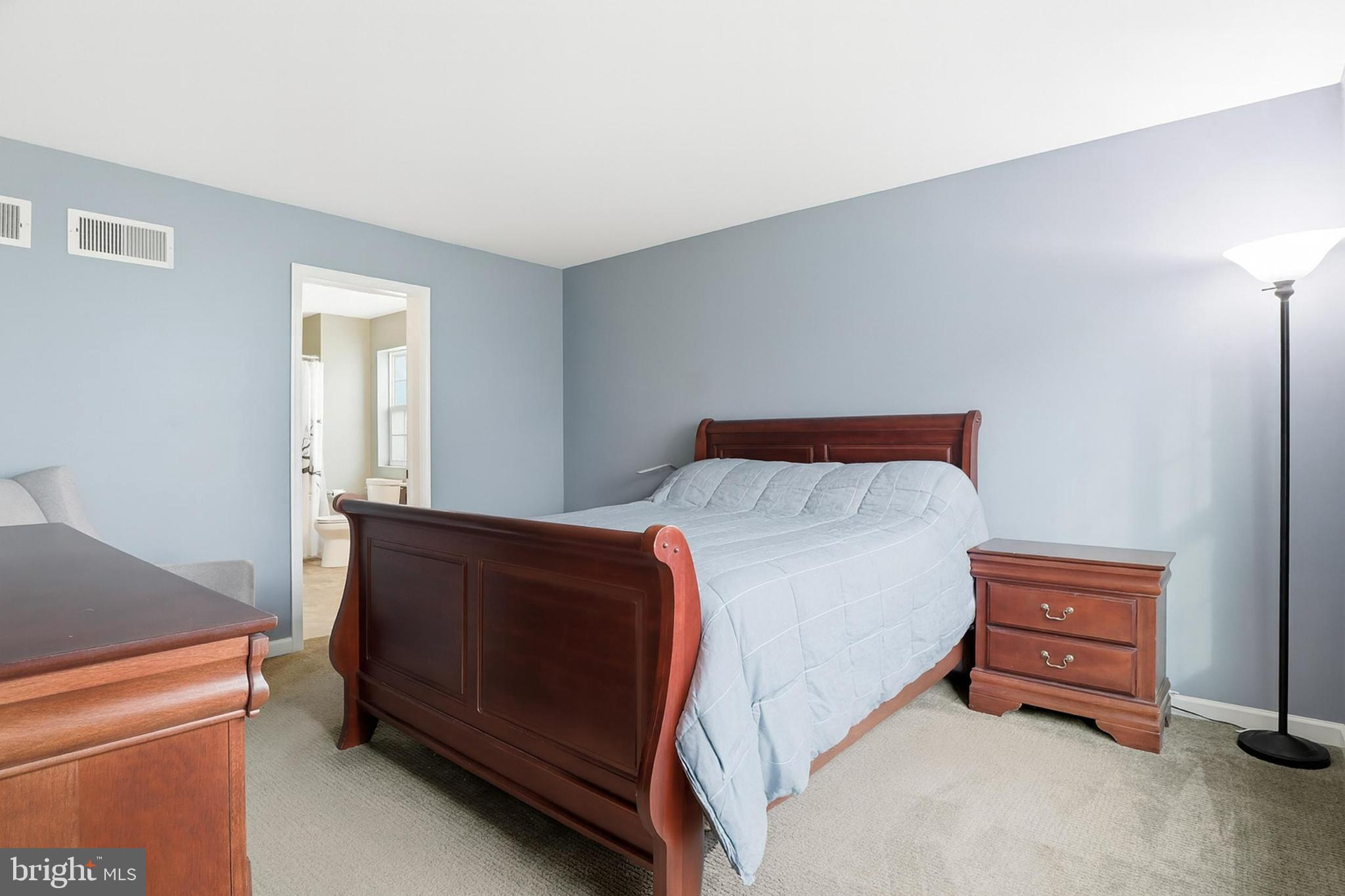 2606 Woodspring Drive York, PA 17402 - Photo 21 of 60 a bedroom with a bed and a dresser