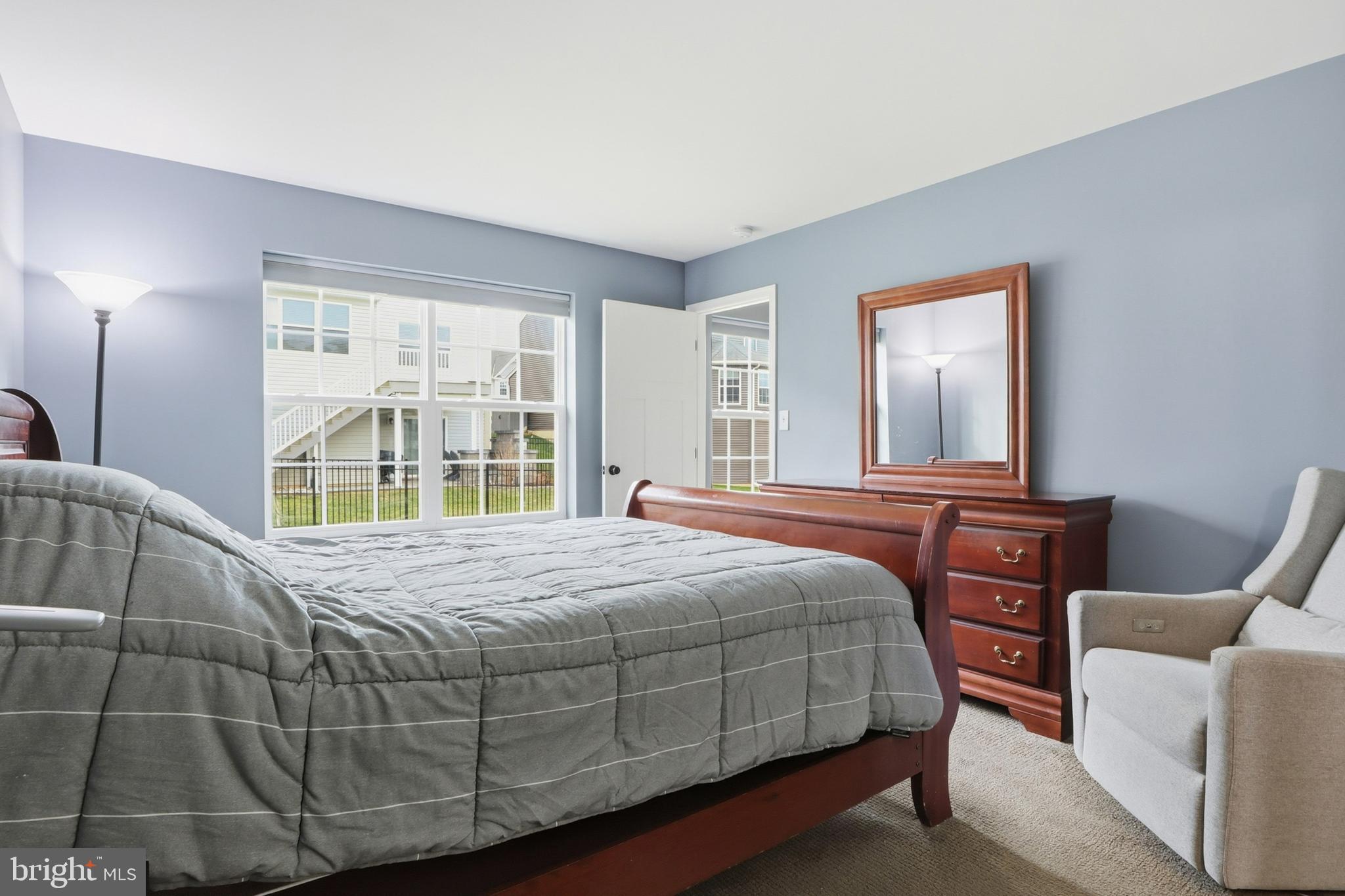 2606 Woodspring Drive York, PA 17402 - Photo 22 of 60 a bedroom with a bed and wooden floor