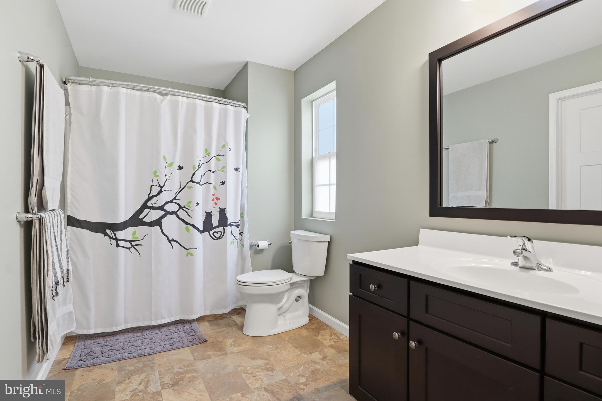 2606 Woodspring Drive York, PA 17402 - Photo 23 of 60 a bathroom with a sink toilet and shower