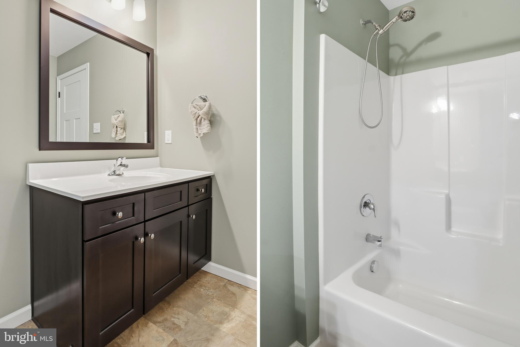 2606 Woodspring Drive York, PA 17402 - Photo 24 of 60 a bathroom with a bath tub sink mirror and vanity