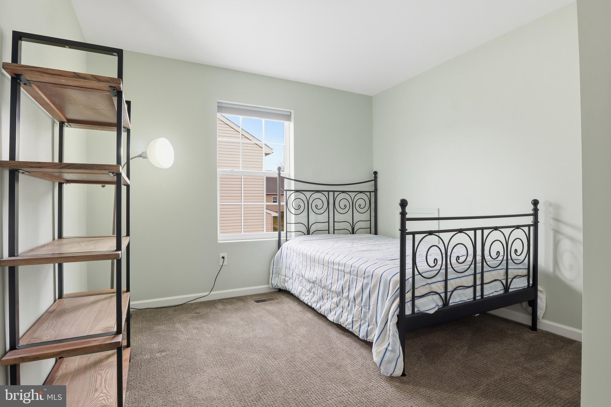 2606 Woodspring Drive York, PA 17402 - Photo 29 of 60 a bedroom with a bed and a window