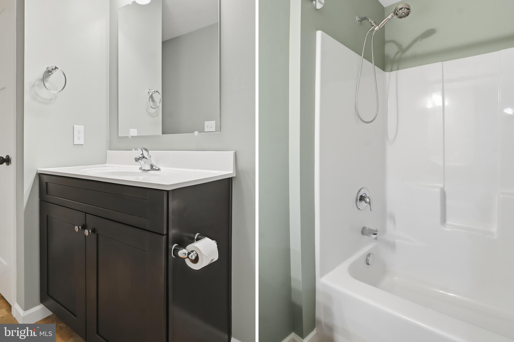 2606 Woodspring Drive York, PA 17402 - Photo 32 of 60 a bathroom with a shower sink and mirror