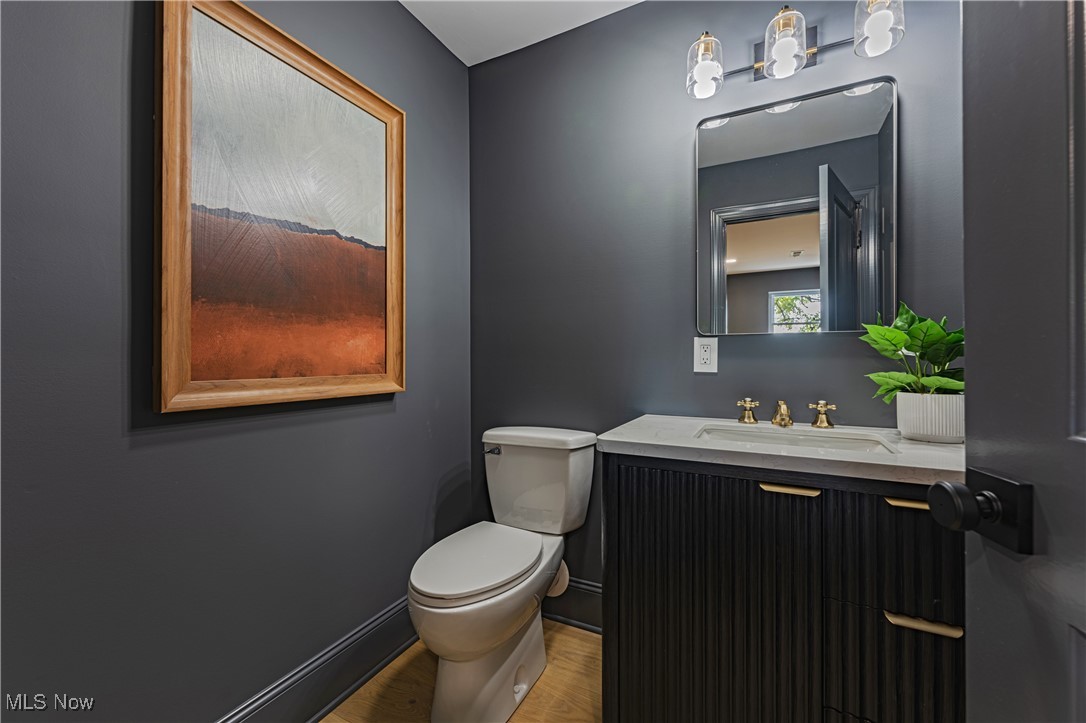 1572 Bell Road Chagrin Falls, OH 44022 - Photo 20 of 36 Bathroom with vanity, toilet, and wood-type flooring