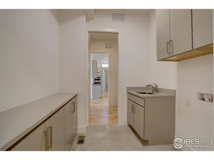 a bathroom with a granite countertop sink a shower and a mirror