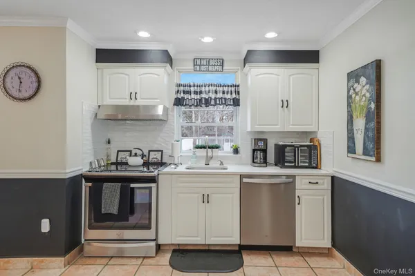 a kitchen with cabinets and window