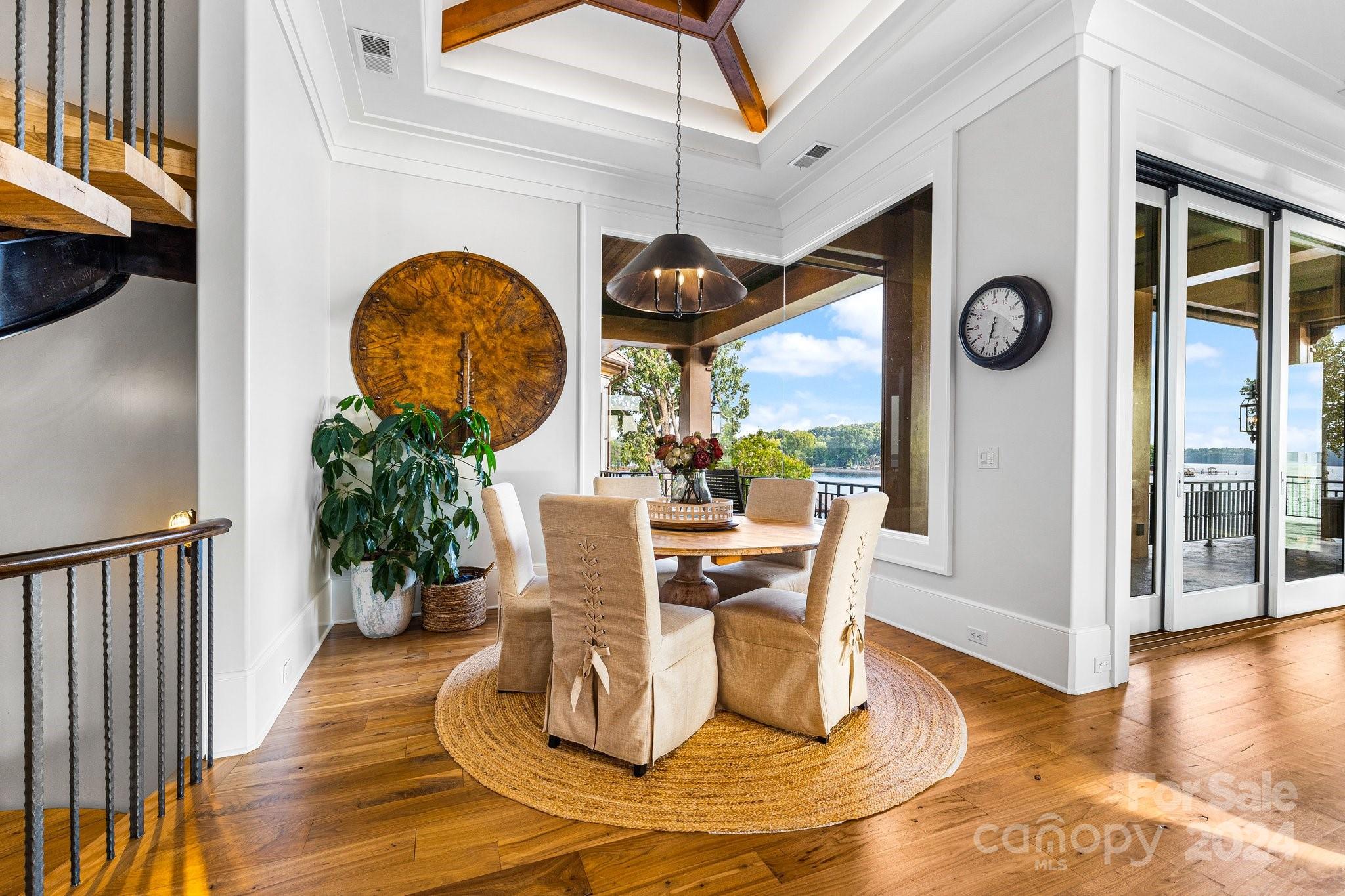 16700 Tinker Place Cornelius, NC 28031 - Photo 14 of 47 a view of a dining room with furniture wooden floor and entryway