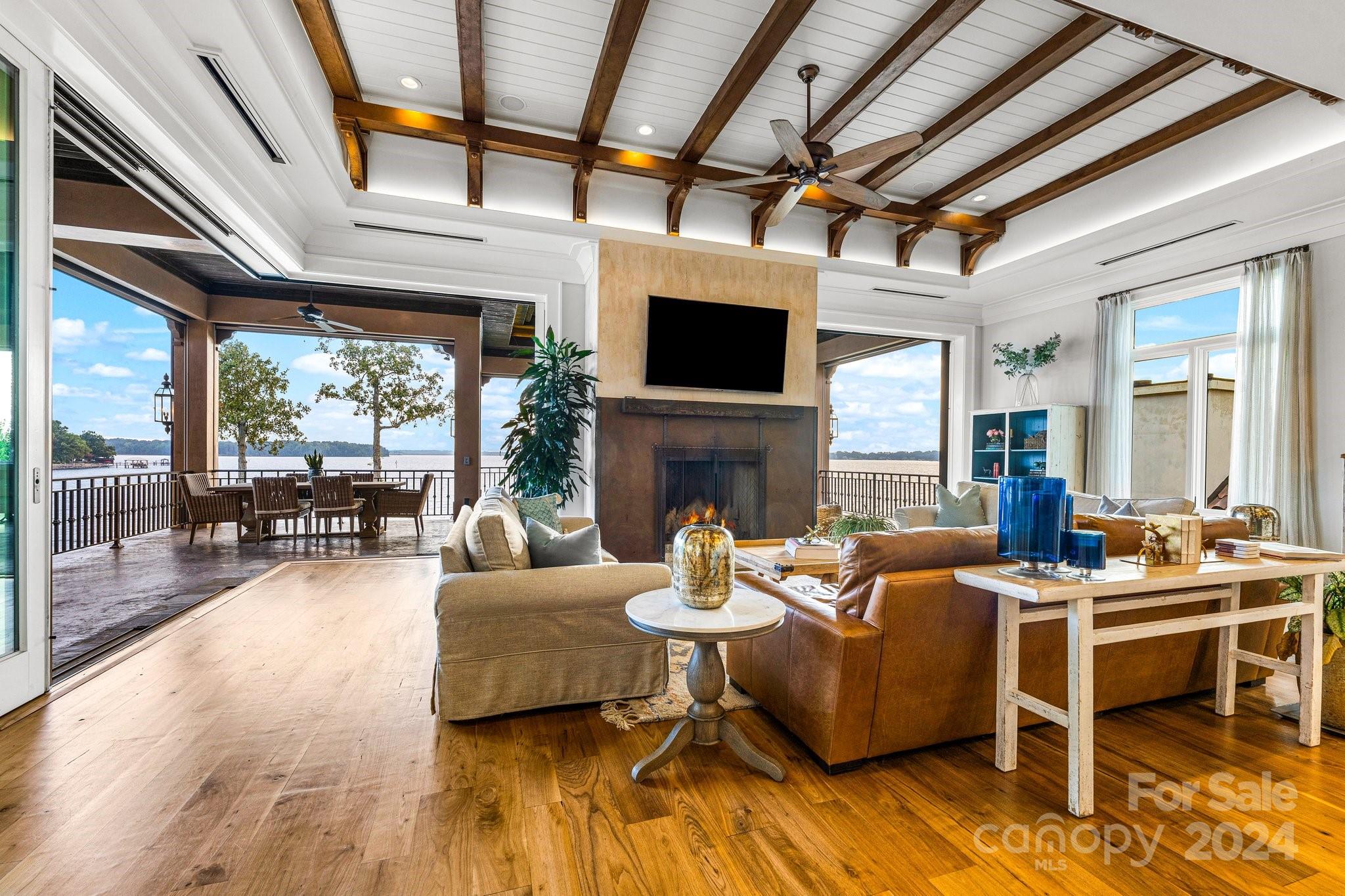 16700 Tinker Place Cornelius, NC 28031 - Photo 15 of 47 a living room with fireplace furniture and a large window