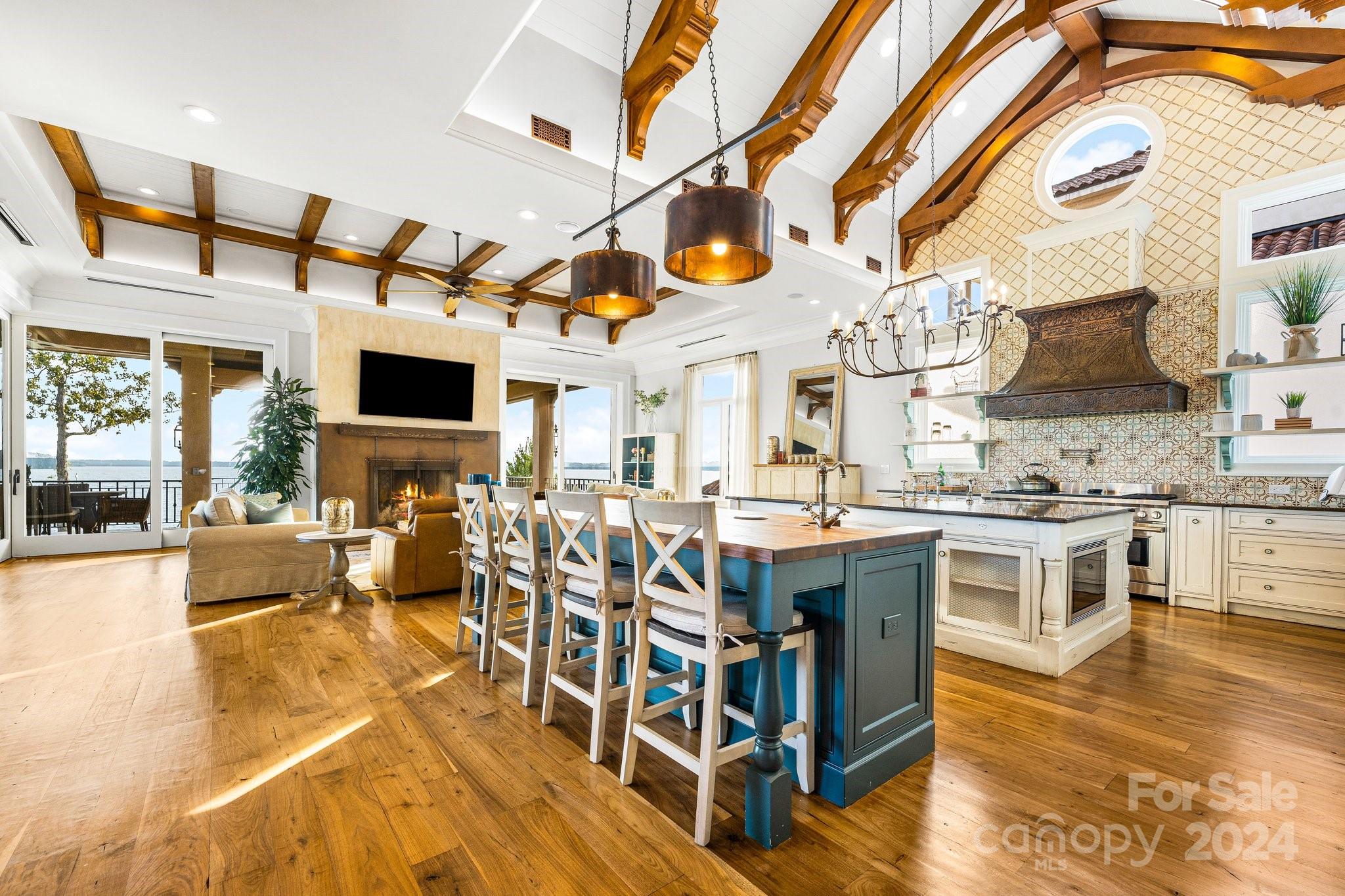 16700 Tinker Place Cornelius, NC 28031 - Photo 17 of 47 a open kitchen with stainless steel appliances granite countertop a stove and cabinets with wooden floor