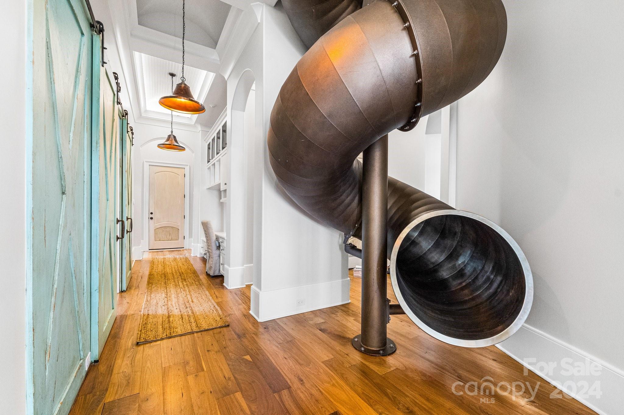 16700 Tinker Place Cornelius, NC 28031 - Photo 20 of 47 a view of a hallway with wooden floor and staircase