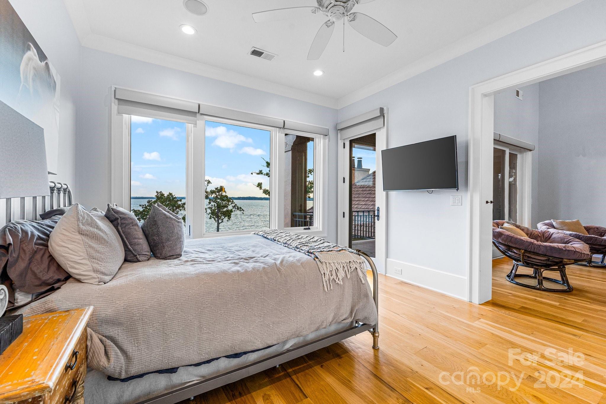 16700 Tinker Place Cornelius, NC 28031 - Photo 25 of 47 a bedroom with a bed and a flat screen tv