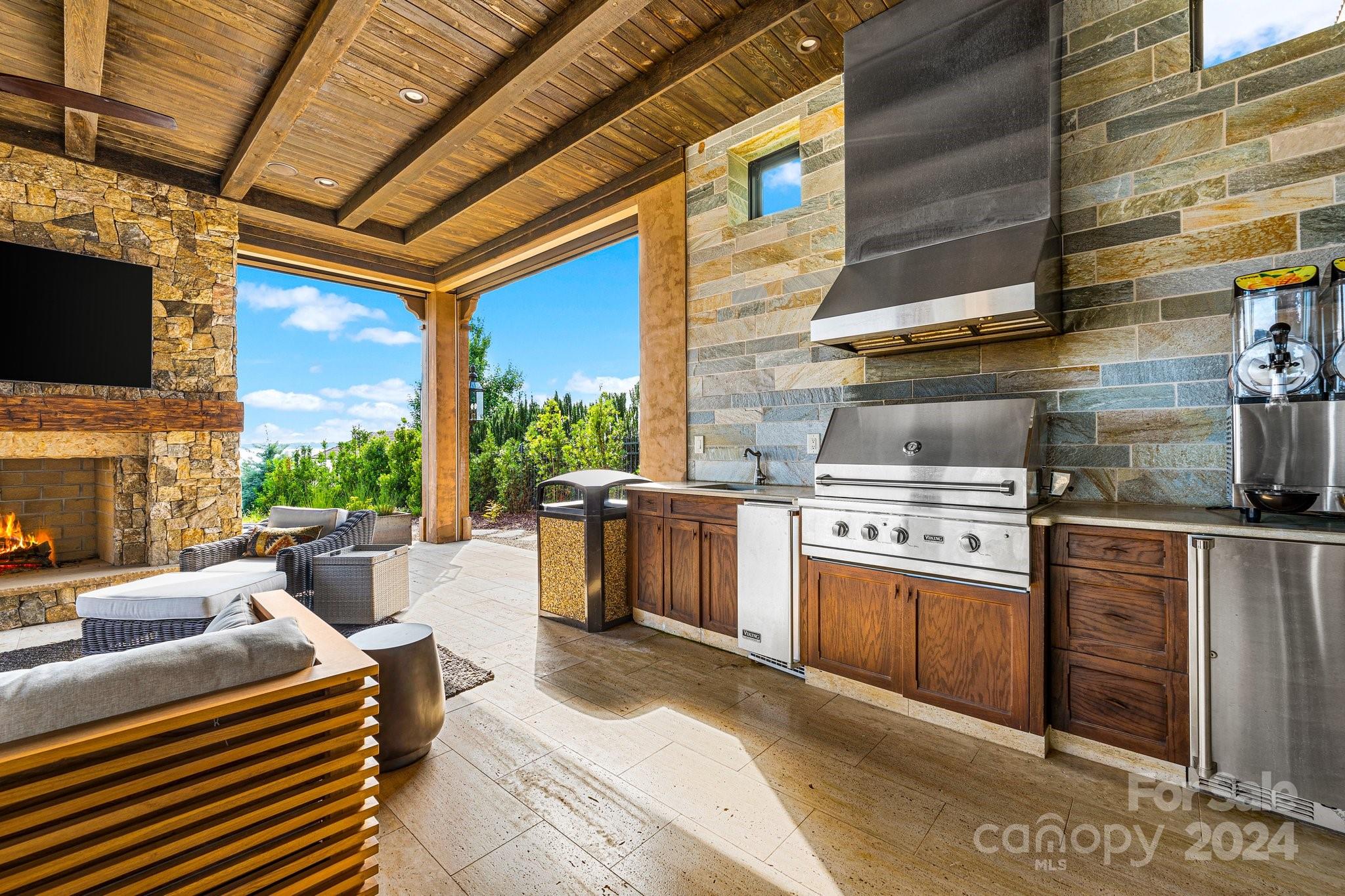 16700 Tinker Place Cornelius, NC 28031 - Photo 40 of 47 a kitchen with stainless steel appliances granite countertop a stove a sink and a refrigerator