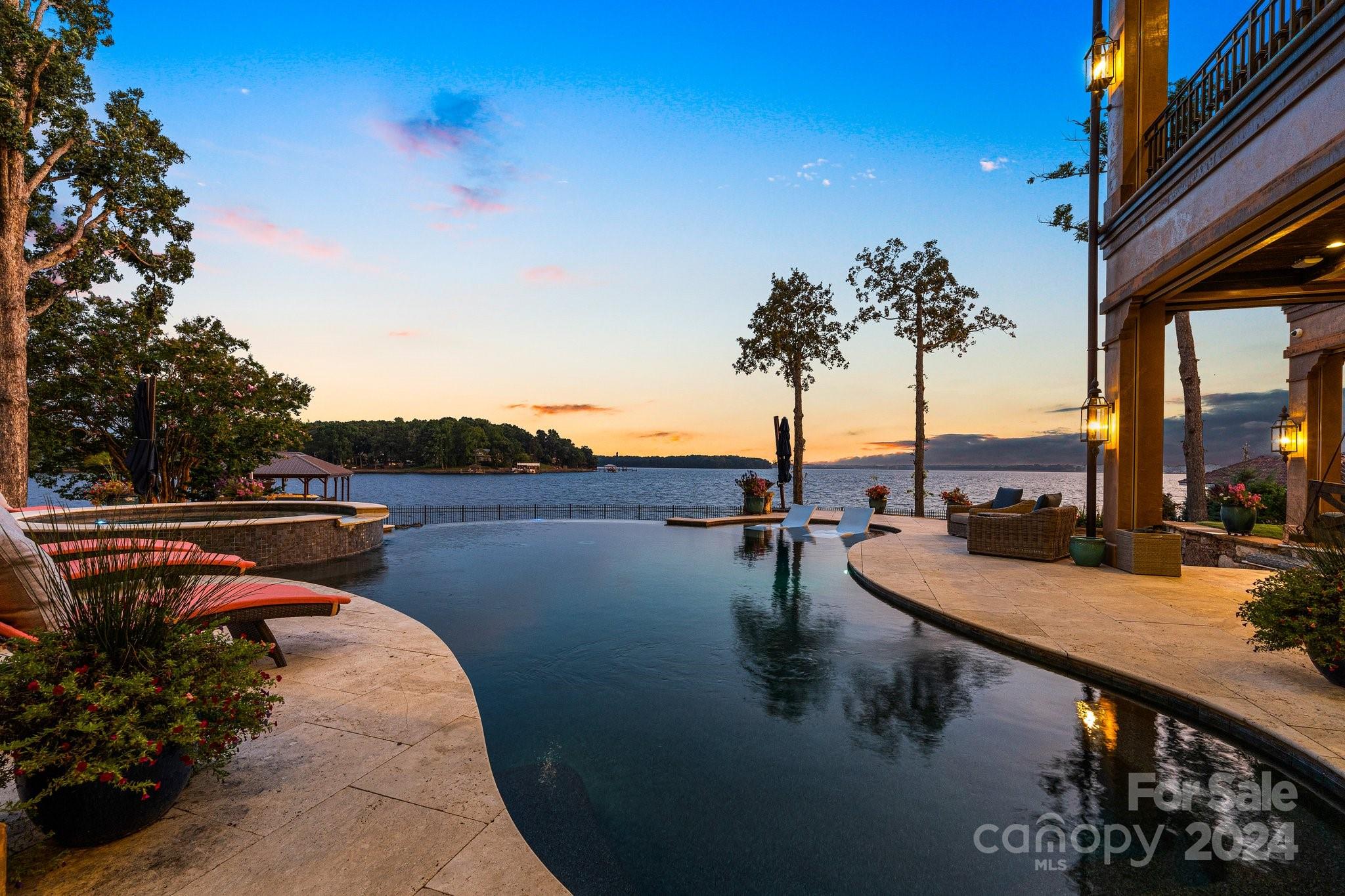 16700 Tinker Place Cornelius, NC 28031 - Photo 47 of 47 a view of a lake with couches in the patio