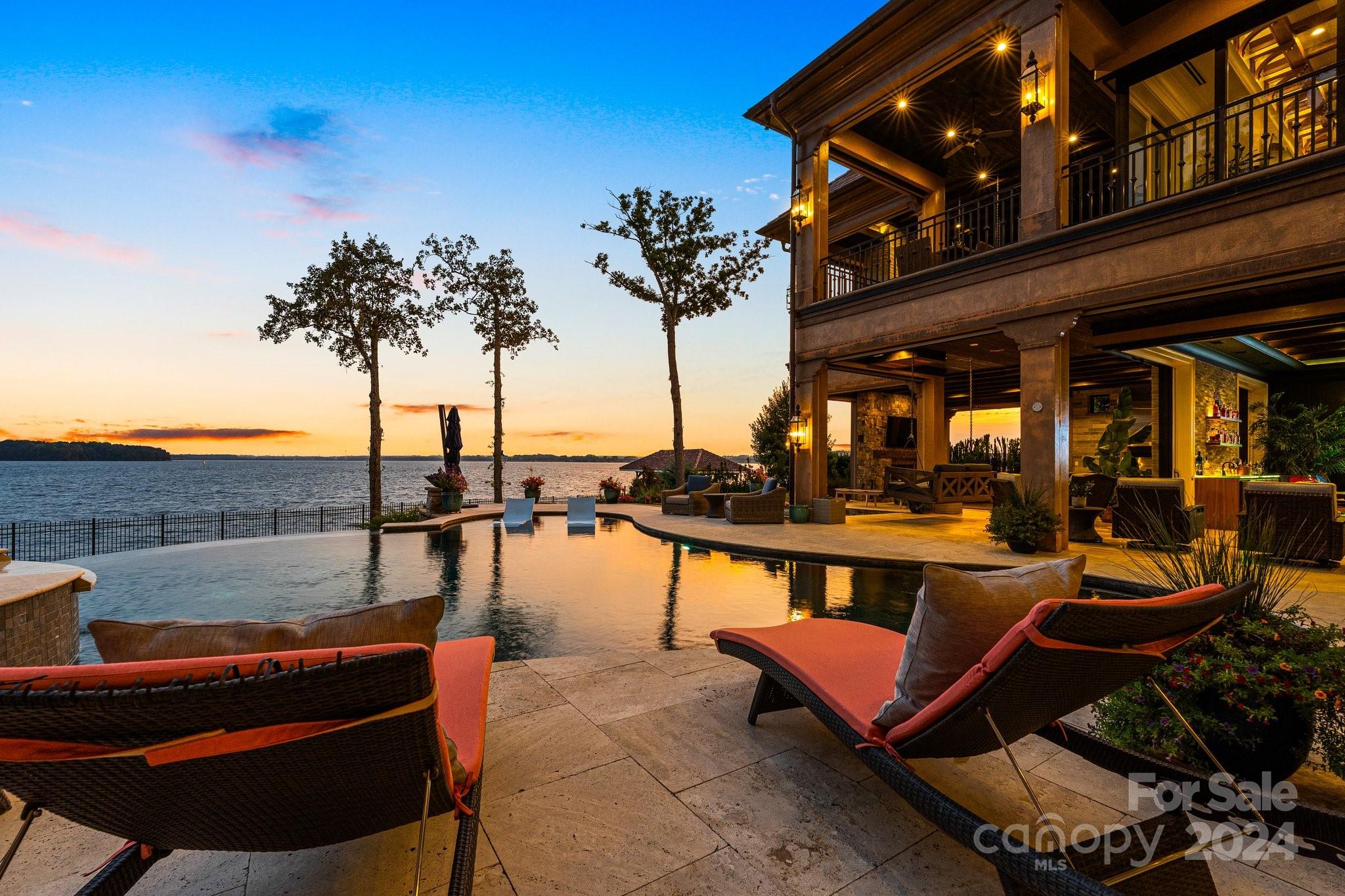 16700 Tinker Place Cornelius, NC 28031 - Photo 7 of 47 a view of a swimming pool with a table and chairs
