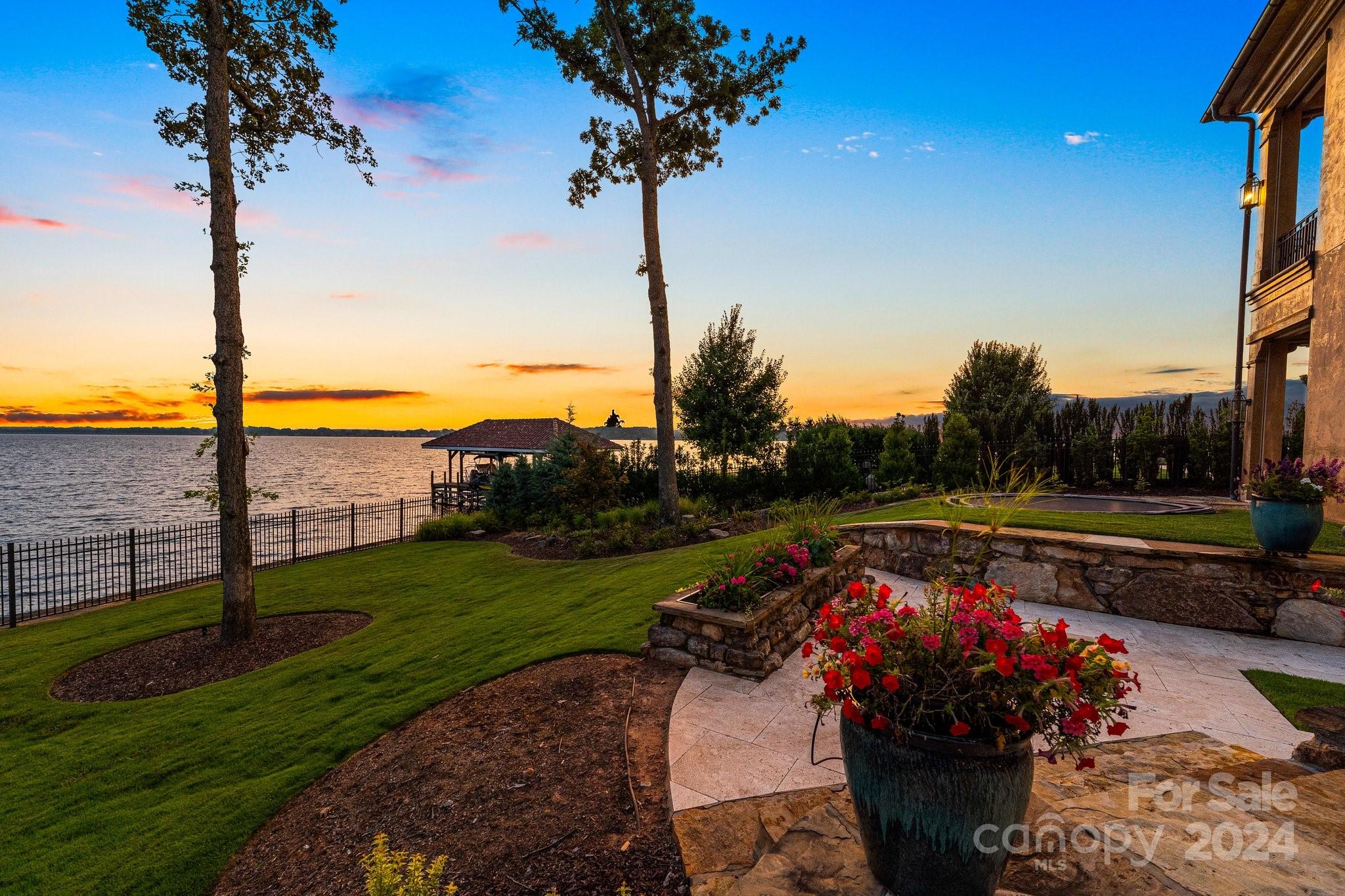 16700 Tinker Place Cornelius, NC 28031 - Photo 8 of 47 a view of a terrace with a garden