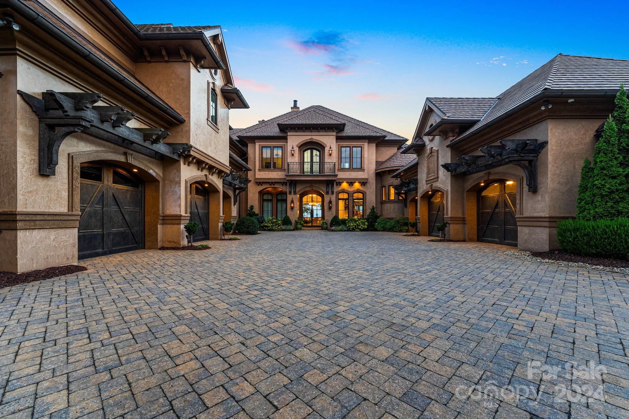 16700 Tinker Place Cornelius, NC 28031 - Photo 9 of 47 a front view of a house with large trees
