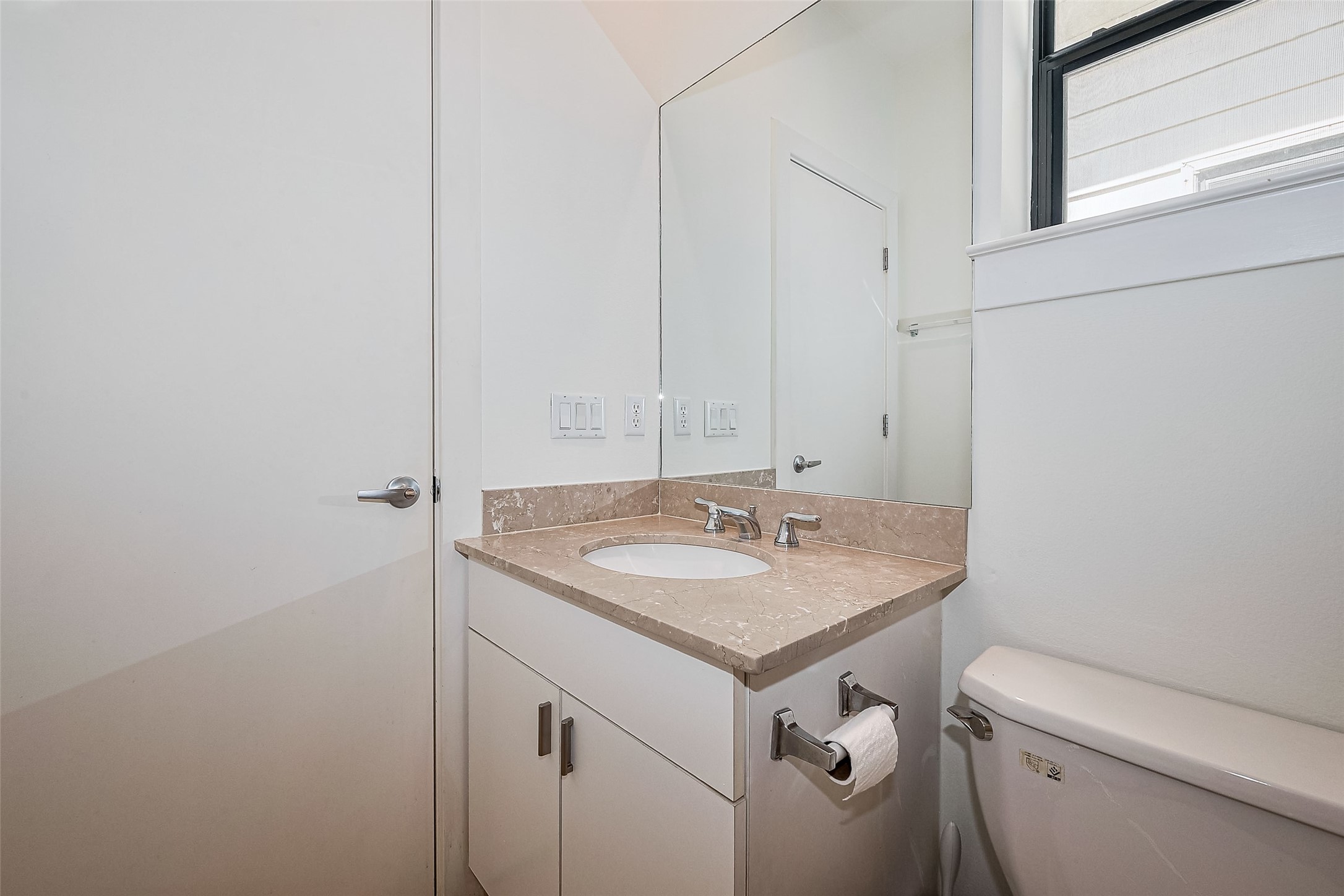 4331 Eigel Street Houston, TX 77007 - Photo 36 of 38 a bathroom with a granite countertop sink and a toilet