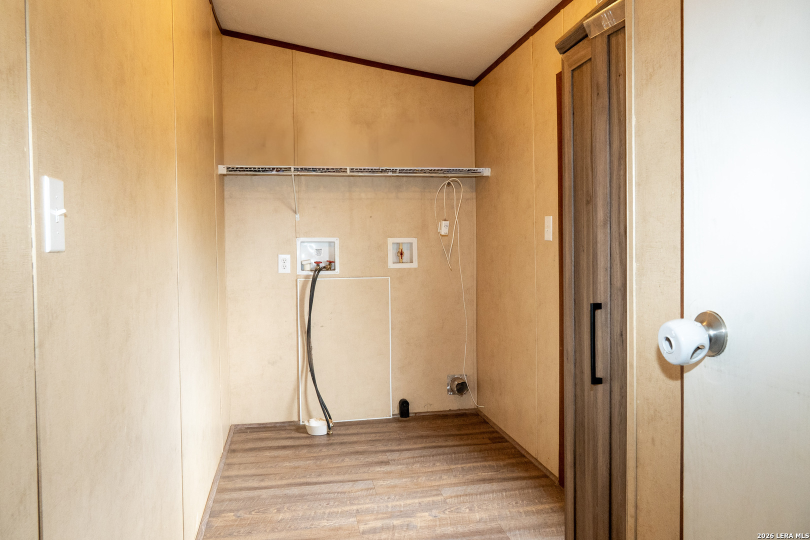 507 Beech Street Jourdanton, TX 78026 - Photo 14 of 17 a view of a room with wooden floor