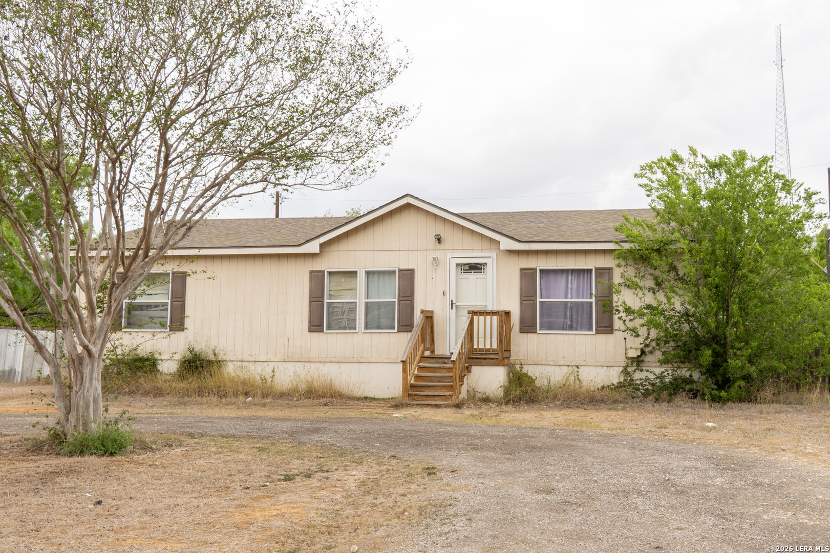 507 Beech Street Jourdanton, TX 78026 - Photo 2 of 17 a front view of a house with a yard and garage