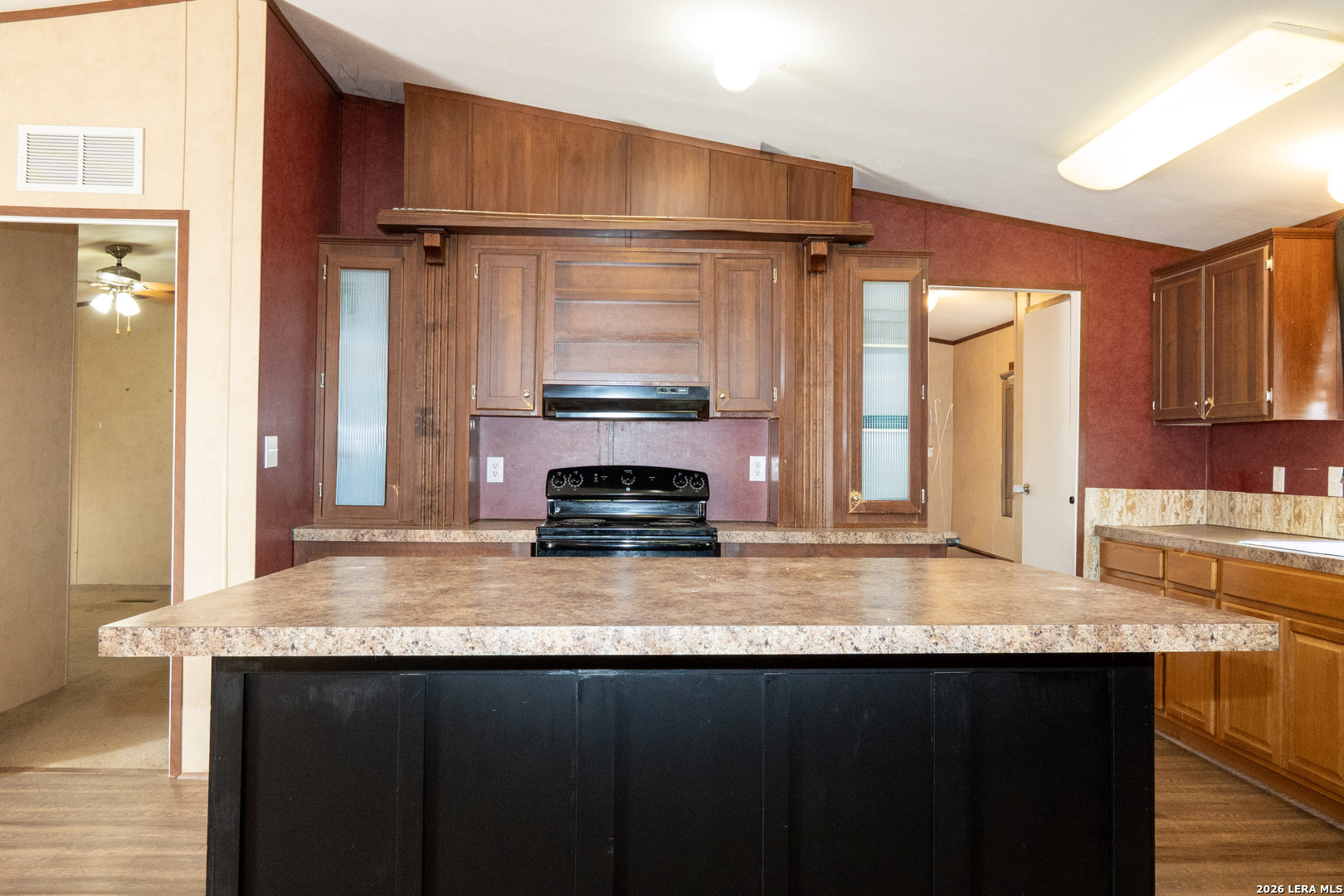 507 Beech Street Jourdanton, TX 78026 - Photo 4 of 17 a kitchen with stainless steel appliances granite countertop a sink a stove and a refrigerator