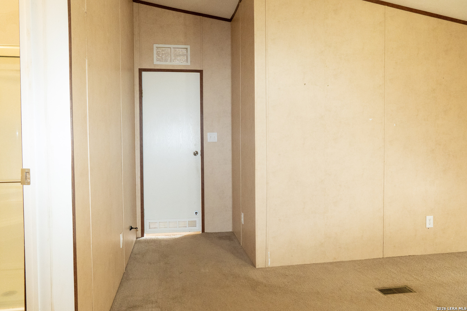 507 Beech Street Jourdanton, TX 78026 - Photo 7 of 17 a view of a small space with wooden floor