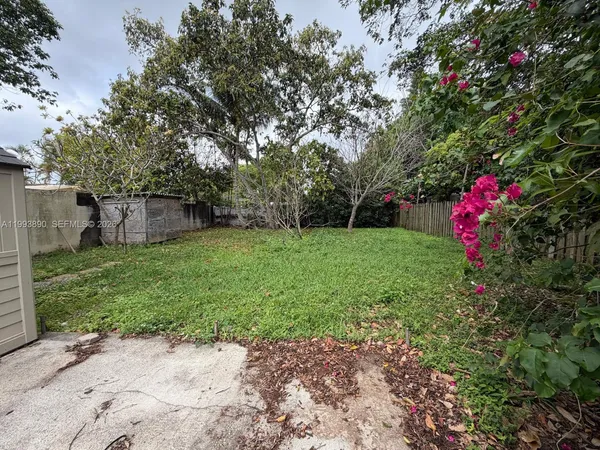 a fire hydrant in the middle of a garden