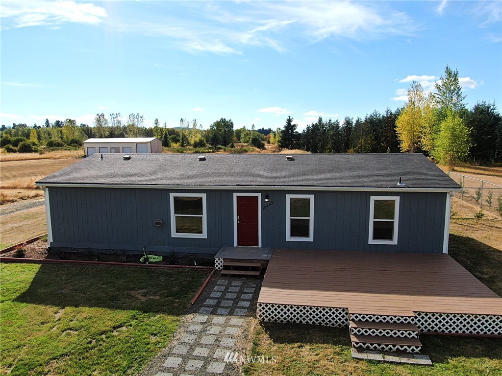 18445 Forstrom Street Southwest Rochester, WA 98579 - Photo 5 of 14 a view of a house with a yard
