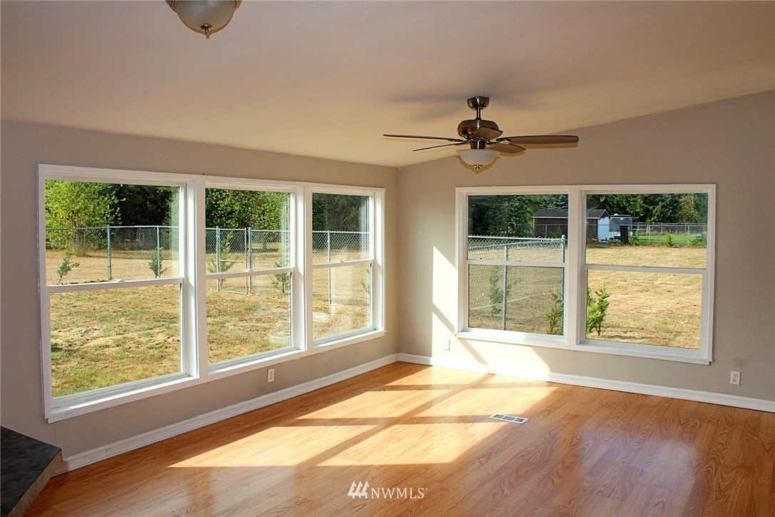 18445 Forstrom Street Southwest Rochester, WA 98579 - Photo 8 of 14 a view of an empty room with a window and balcony