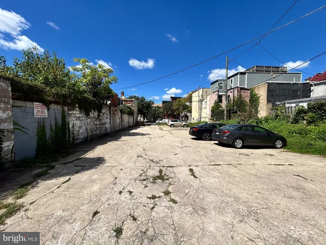 a view of a street with a building in the background