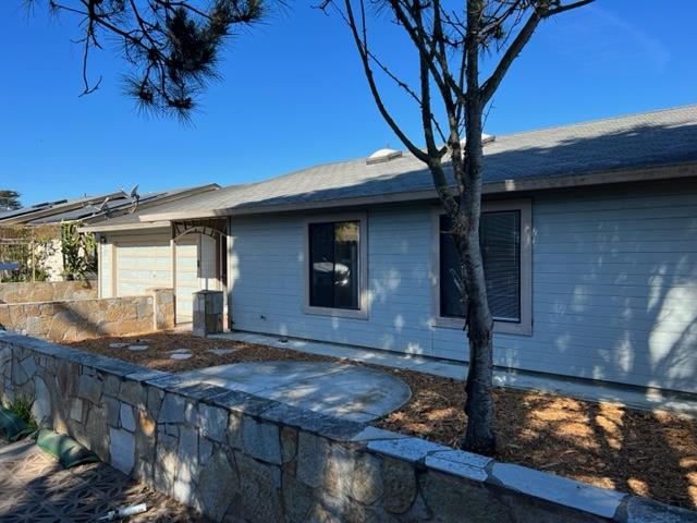 239 Mortimer Lane Marina, CA 93933 - Photo 3 of 87 a view of house with wooden fence and a tree