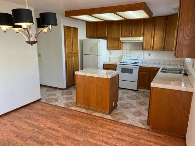 239 Mortimer Lane Marina, CA 93933 - Photo 37 of 87 a kitchen with refrigerator and cabinets
