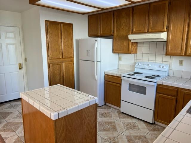 239 Mortimer Lane Marina, CA 93933 - Photo 41 of 87 a kitchen with stainless steel appliances a stove refrigerator sink and cabinets