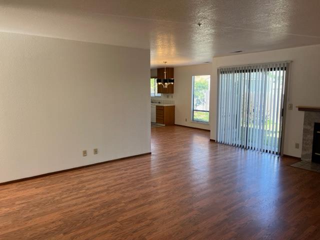 239 Mortimer Lane Marina, CA 93933 - Photo 5 of 87 an empty room with wooden floor and windows