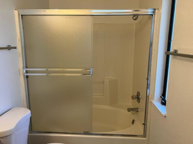 239 Mortimer Lane Marina, CA 93933 - Photo 68 of 87 a bathroom with a shower and a toilet