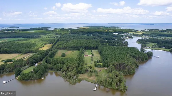 an aerial view of a houses with outdoor space and street view