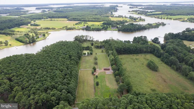 a view of house with backyard and seating space